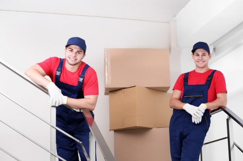 Removal team pricing a flat clearance in Poplar