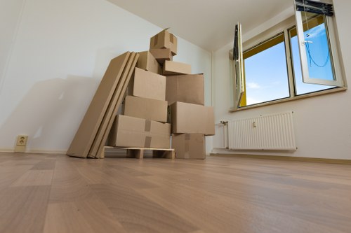 Packed moving boxes and labelled belongings ready for relocation