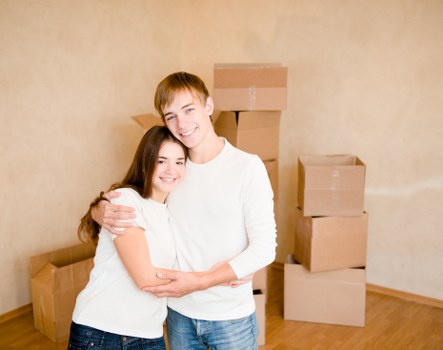 Professional movers handling furniture during a Poplar home relocation